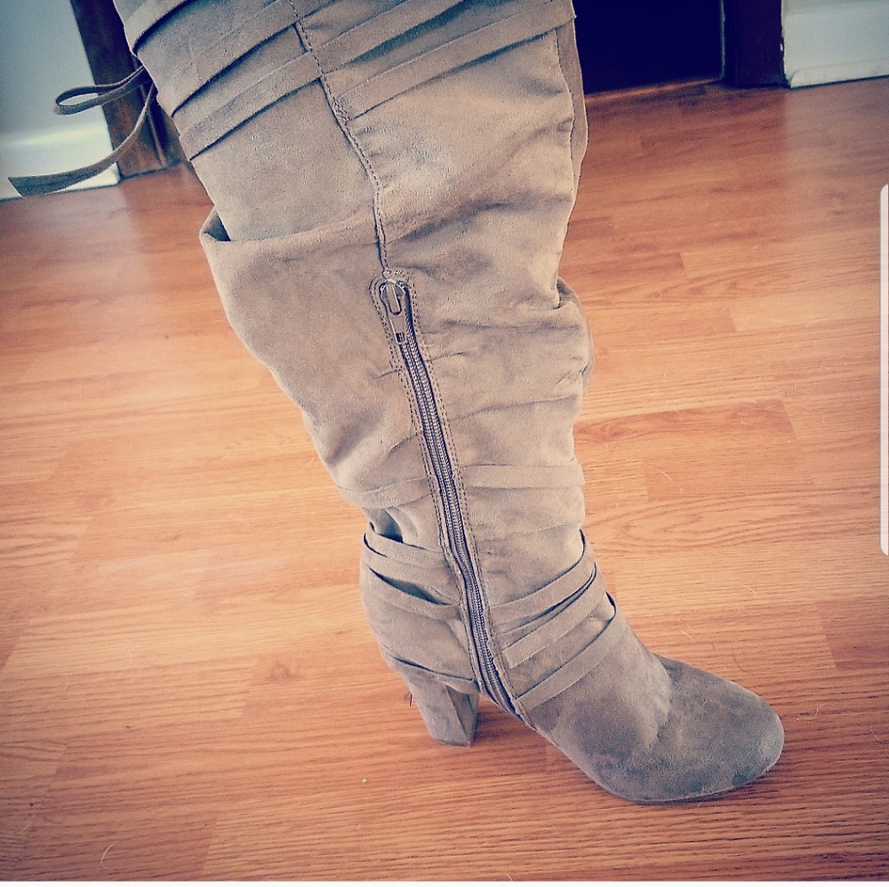 Knee high suede boots.